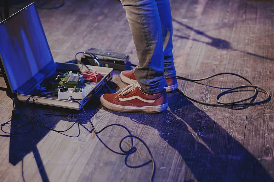 man, standing, guitar effects, pedal, person, gray, jeans, red, vans, old