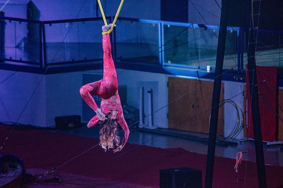 acrobat, pink, circus, performer, attraction, real people, one person, skill, built structure, full length