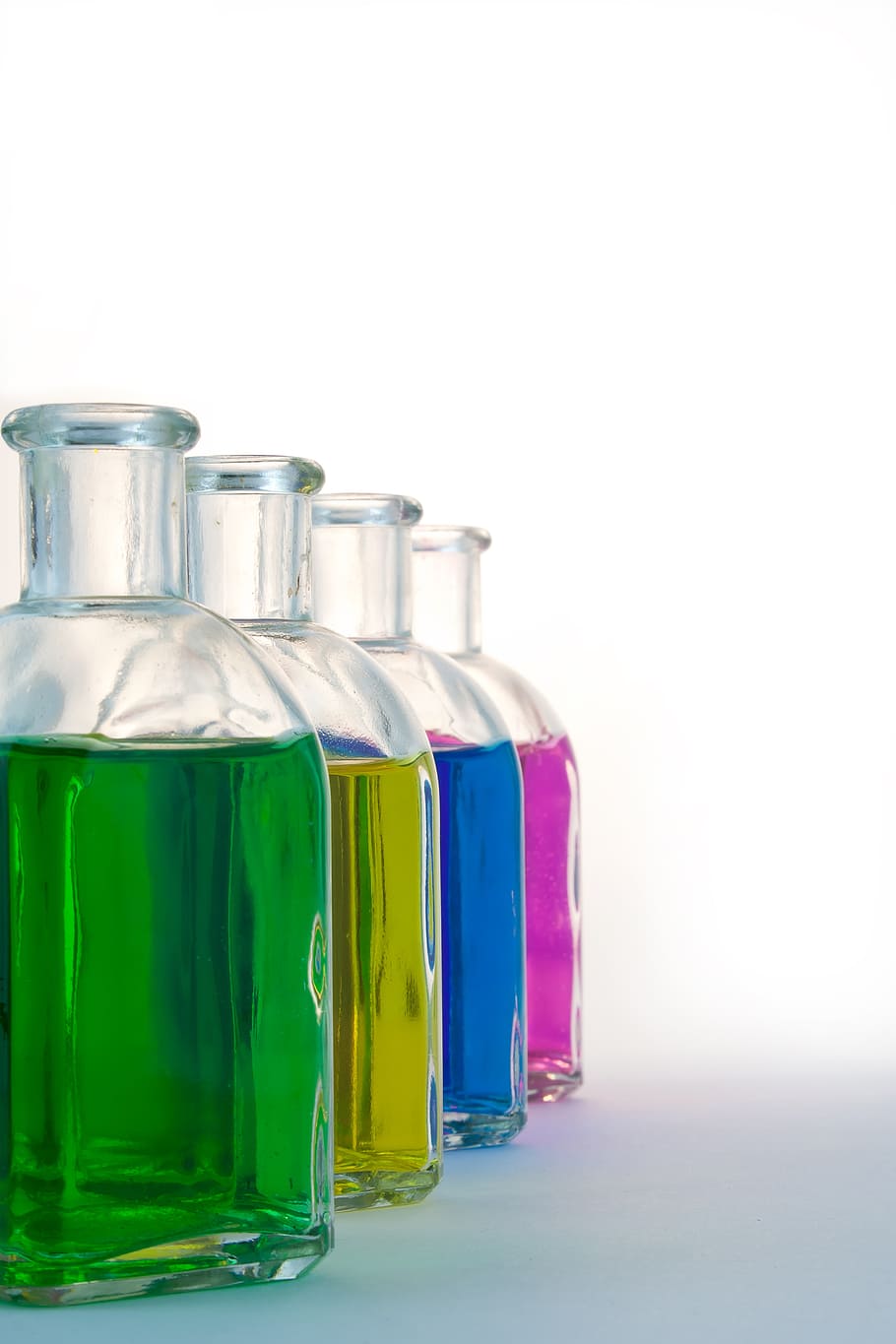 four, clear, glass flasks, several, assorted-color liquids, bottles, colorful, glass, color, blue