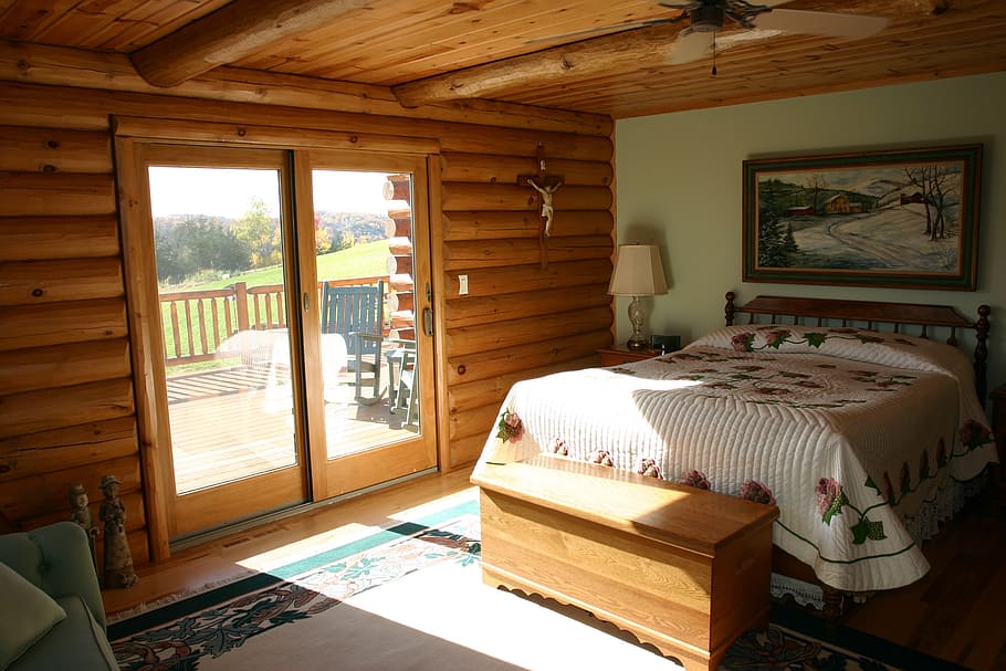 white, black, floral, bedspread, inside, room, master bedroom, bed, logs, cabin