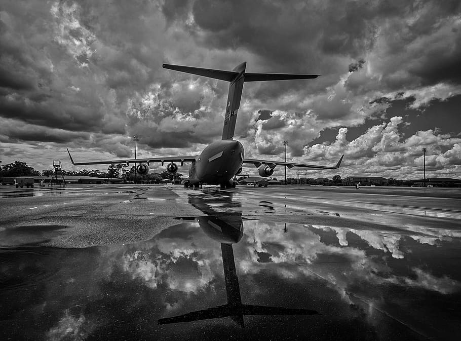 grayscaled photo, airplane, aircraft, plane, jet, military, air force, sky, clouds, tarmac