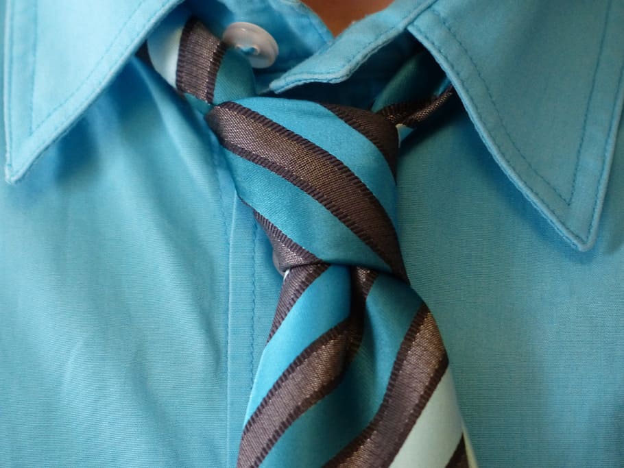 person, wearing, teal shirt, stripe necktie, tie, tie knot, shirt, suit, knot, light blue