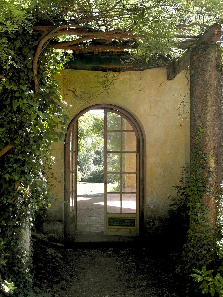 arch, white, wooden, multi-lite door, green, vine plants, daytime, villa real, tuscany, italy