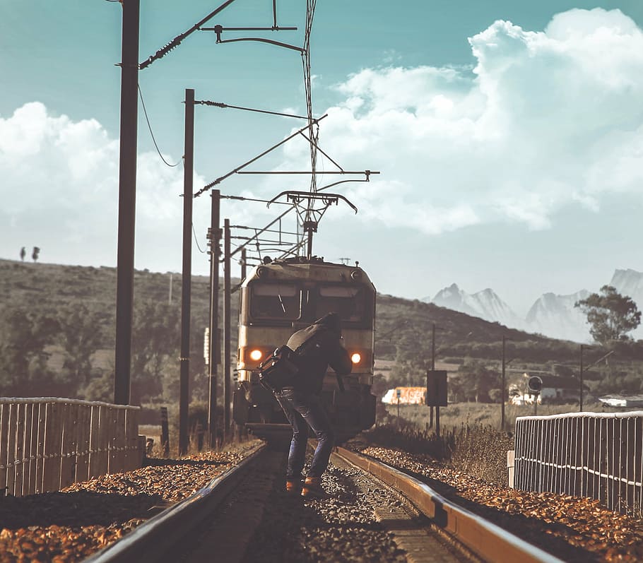 person, capturing, moving, train, railroad, daytime, standing, railway, transportation, track