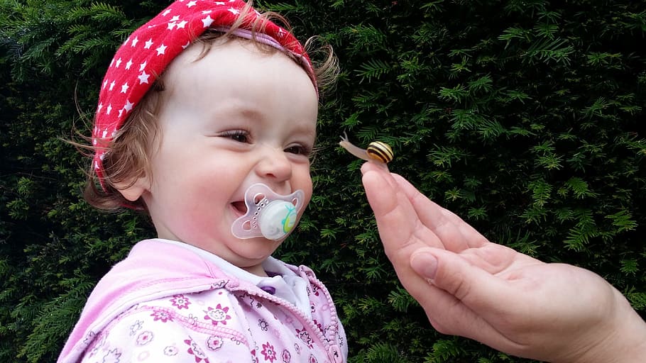 girl, biting, white, pacifier, baby, small child, laugh, joy, snail, joy of life