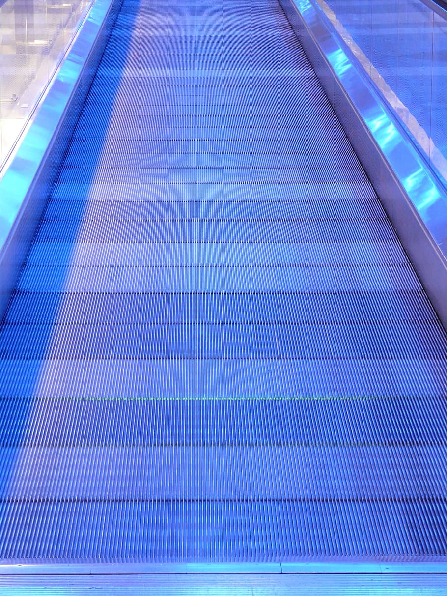 metal segments, moving walkway, roller platform, treadmill, moving sidewalk, rolling pavement, means of rail transport, escalator, neon, blue