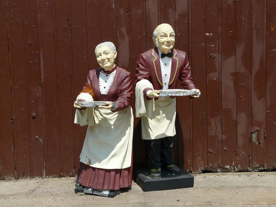 waiter, waitress statues, brown, fence, man, woman, pair, old, figures, begging