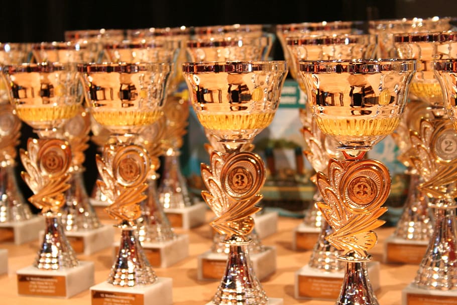 silver-and-gold-colored chalices close-up photo, cup, winner, award, glass, food and drink, large group of objects, refreshment, close-up, in a row
