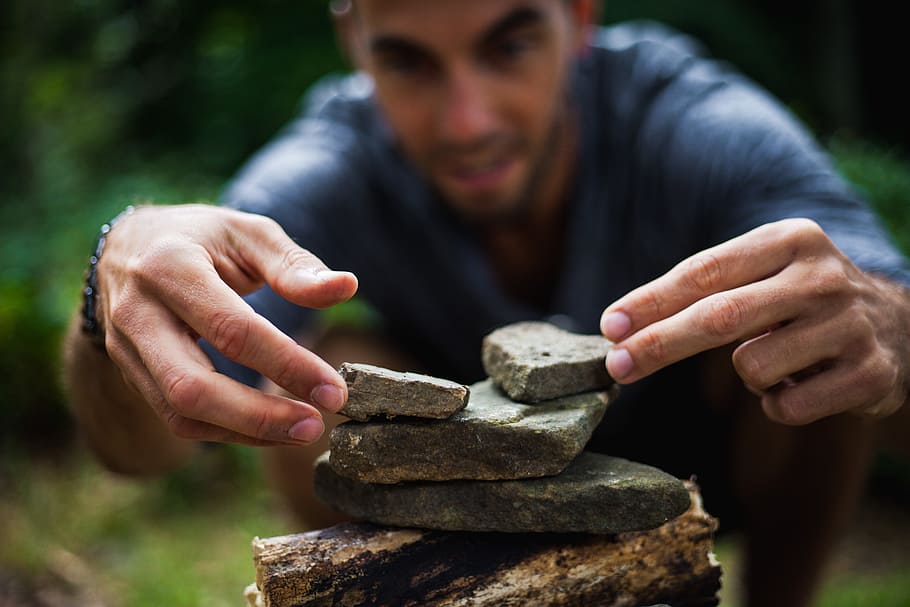 person, holding, gray, rocks, building, zen, man, boy, pyramid, game