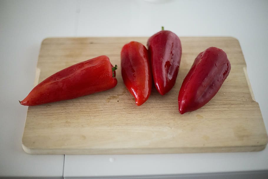 several, red, capsicums, top, rectangular, brown, wooden, cutting, board, vegetable