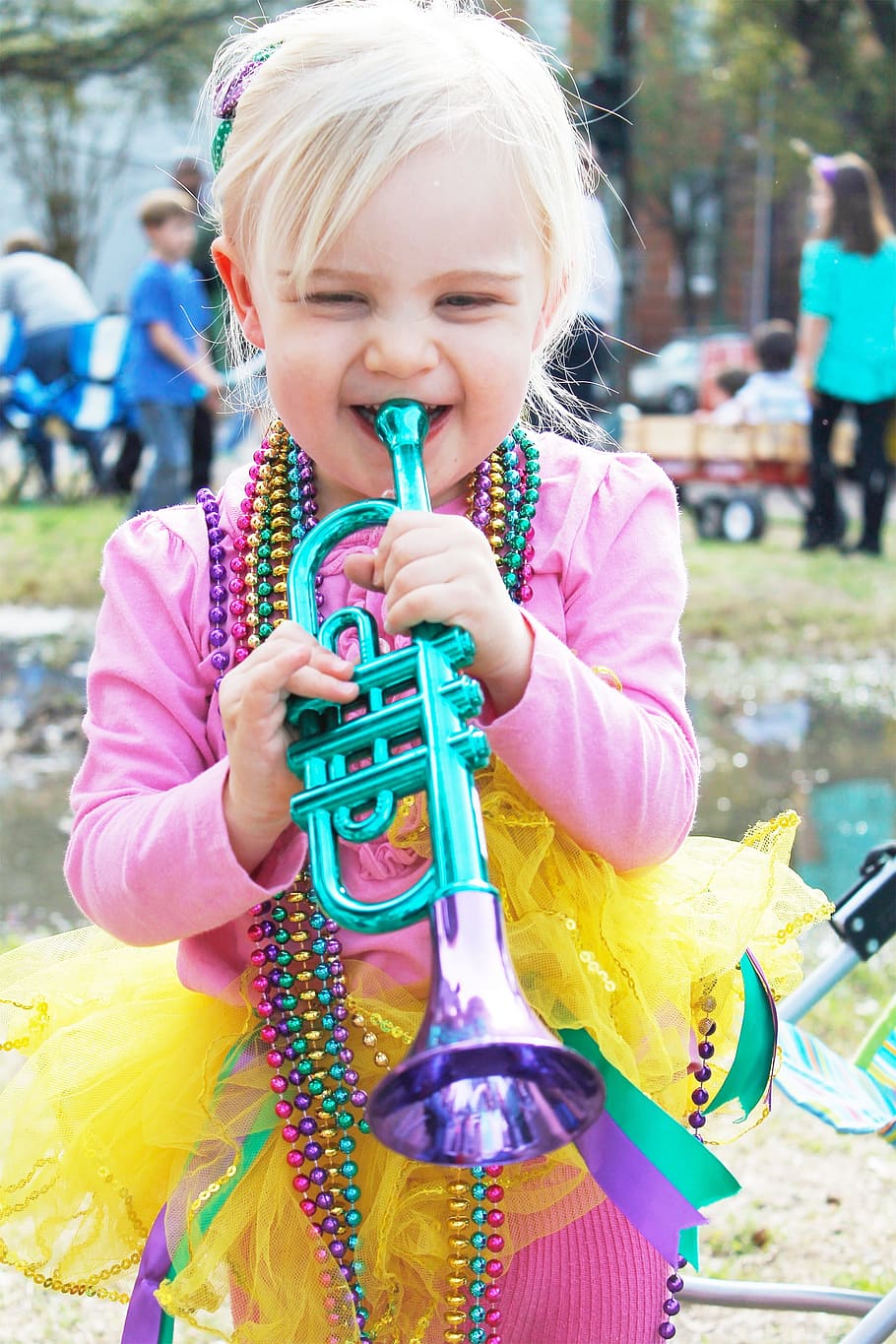 girl, playing, trumpet toy, new orleans, parade, carnival, beads, mardi gras, mardi gras beads, festival