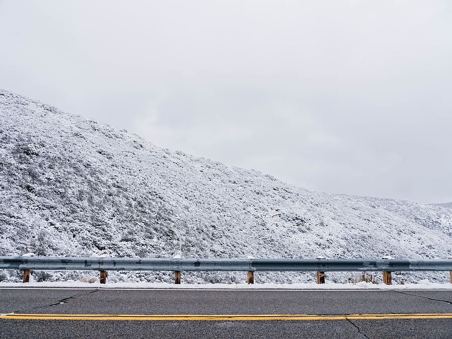 snow, hillside, street, yellow, guard rail, winter, cold temperature, mountain, beauty in nature, transportation