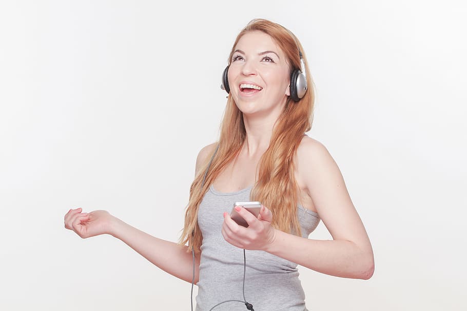 woman wearing headphones, attractive woman, headphones, smartphone, global, mobile phone, mobile, phone, communication, together