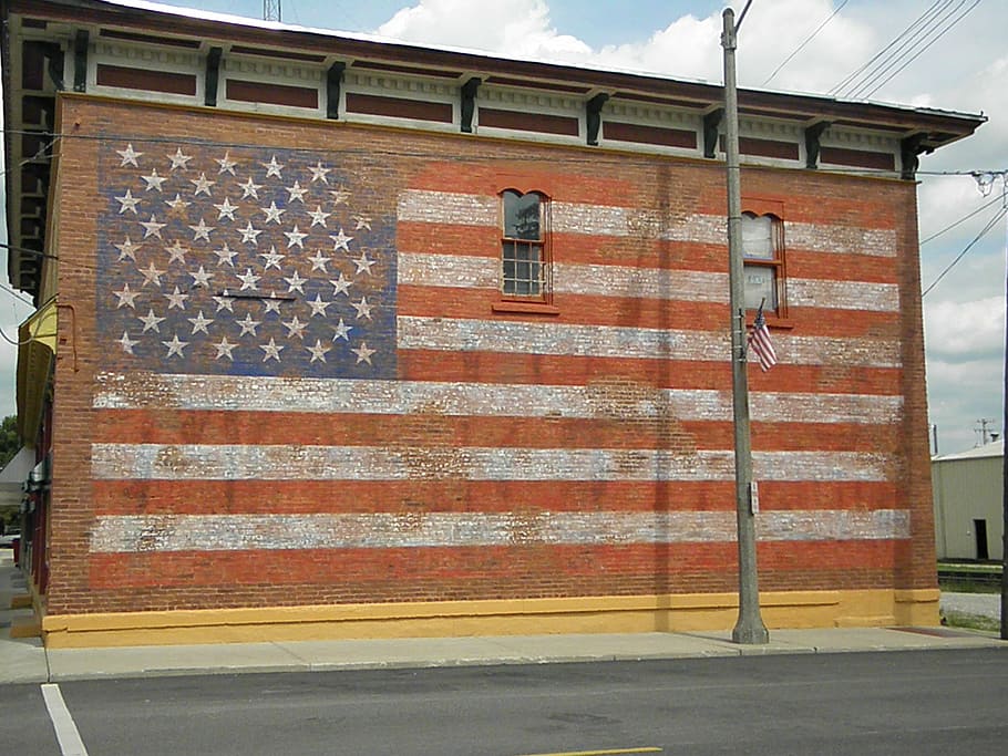 american flag, old glory, building art, built structure, architecture, building exterior, day, building, city, window
