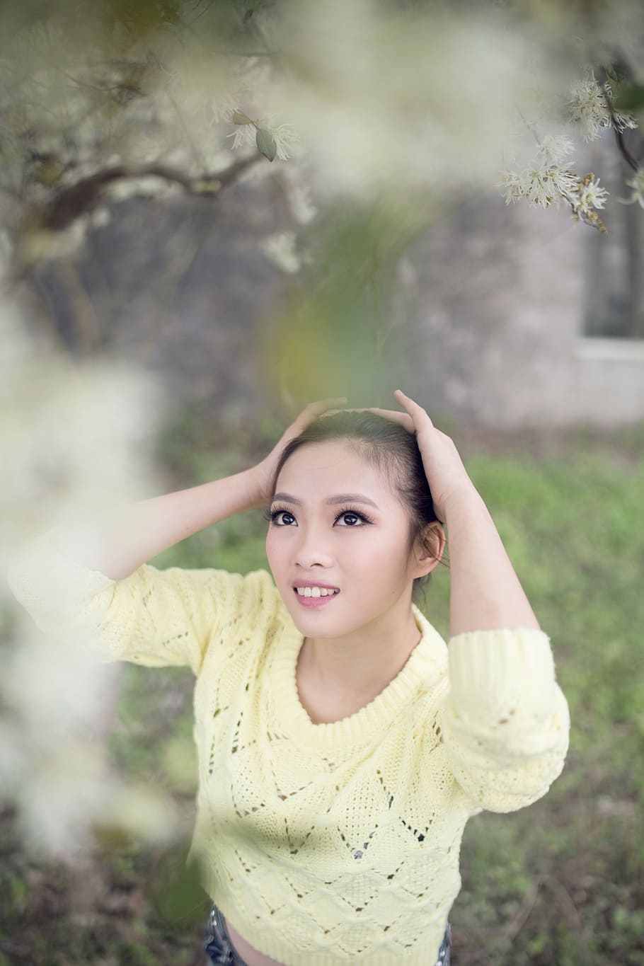 woman, yellow, sweater, holding, head, looking, flower, spring outing, lake, spring garden party