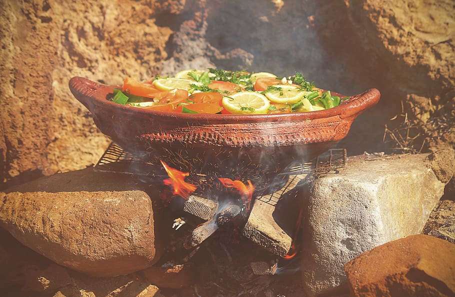pot, grill, charcoal, outdoor, fire, sparks, smoke, rocks, tomato, green