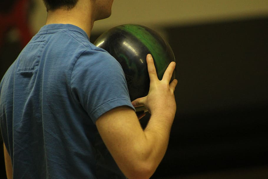 man holding ball, bowling, ball, bowl, player, playing, game, sports, competition, sport