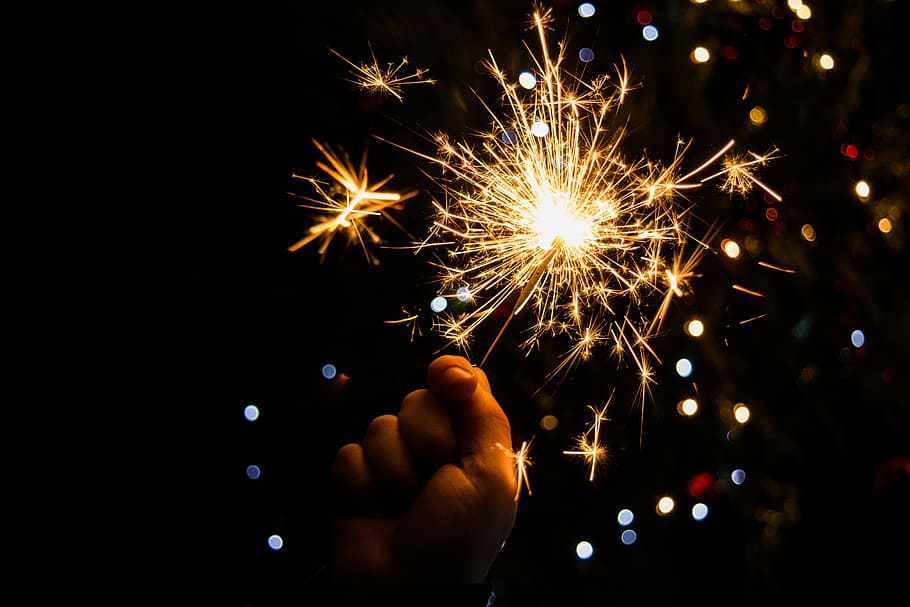 person, holding, sparkler, background, boke lights, effulgence, christmas, celebration, firework - Man Made Object, fire - Natural Phenomenon