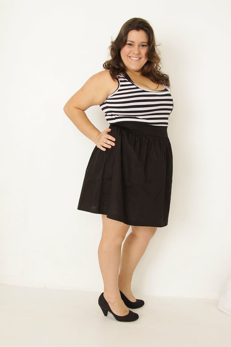 smiling, woman, black, white, striped, sleeveless mini dress, fat, plus size, portuguese, model