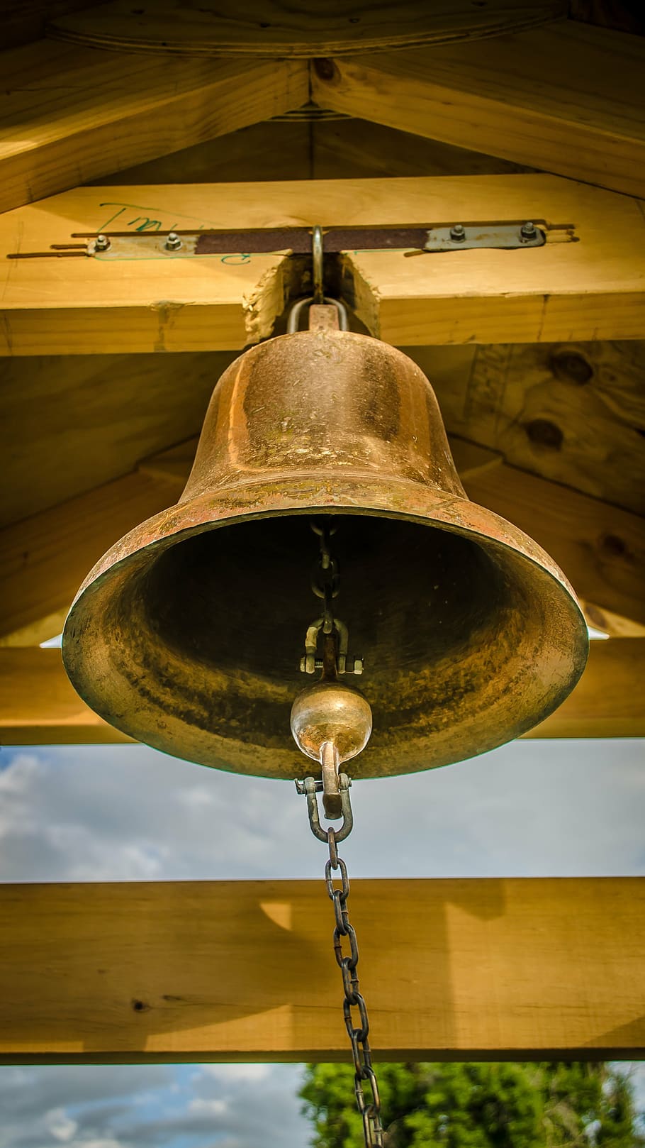 low-angle photography, gold-colored bell, campaign, bell tower, bronze, school, church, metal, hanging, close-up