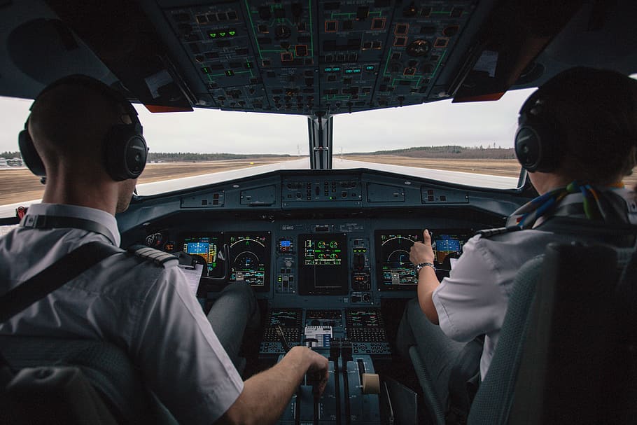 pilots riding airplane, cockpit, pilot, people, men, airplane, travel, transportation, trip, runway