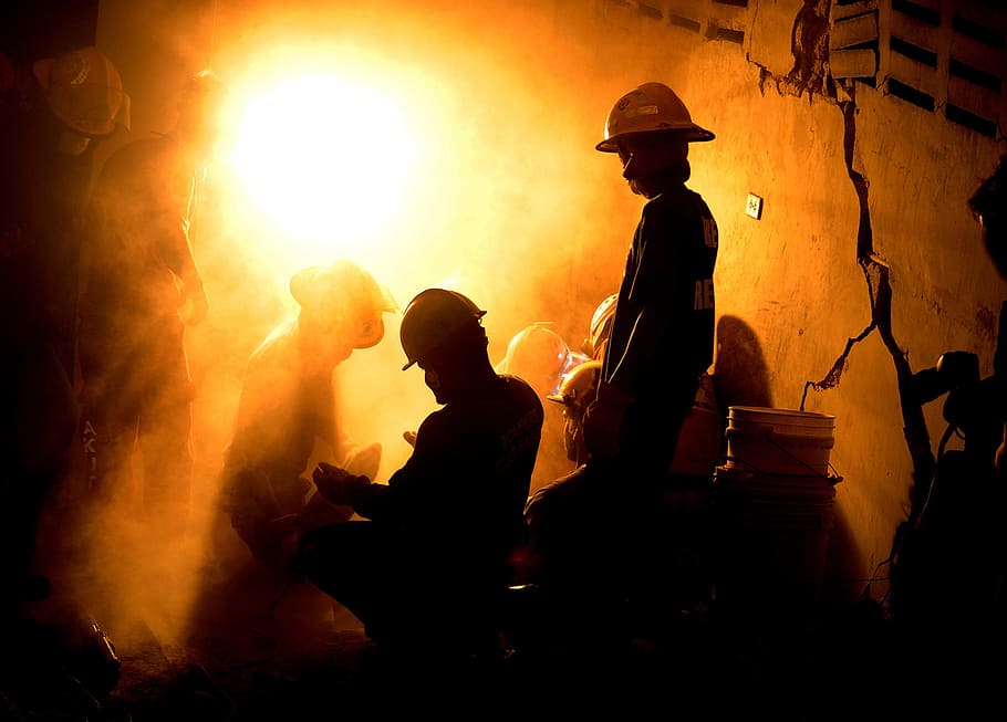 silhouette photo, miners, port-au-prince, haiti, rescuers, firefighter, girl trapped, night, evening, silhouette