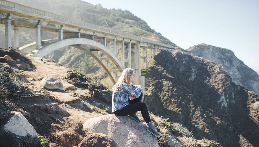 woman, dress shirt, sits, grey, rock, bridge background, sad woman, female, alone, bridge