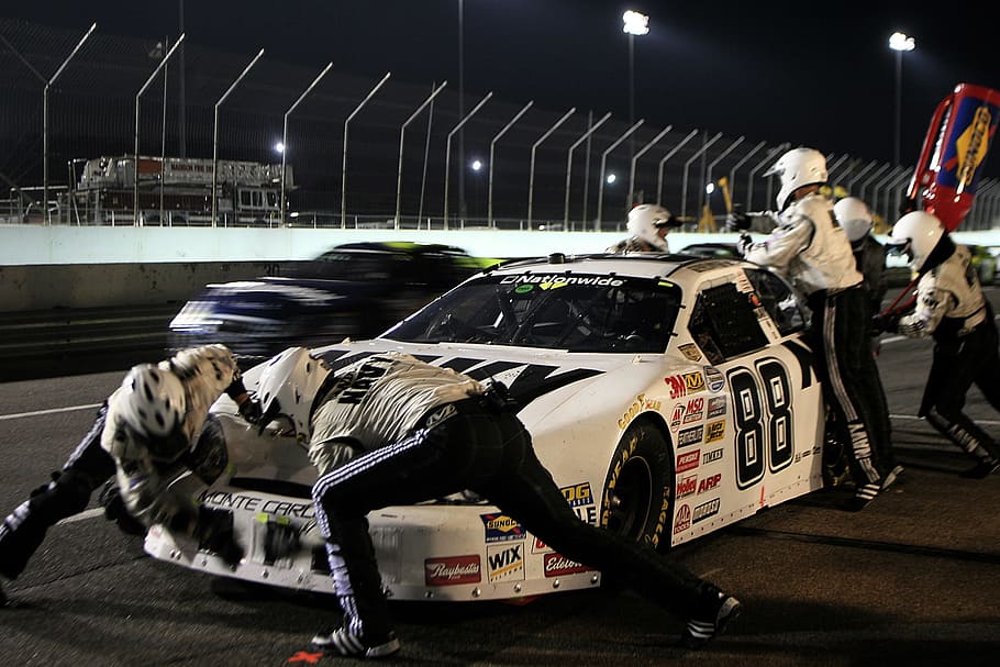 people, repairing, white, stock car, nighttime, pit crew, pit stop, nascar, tires, gasoline