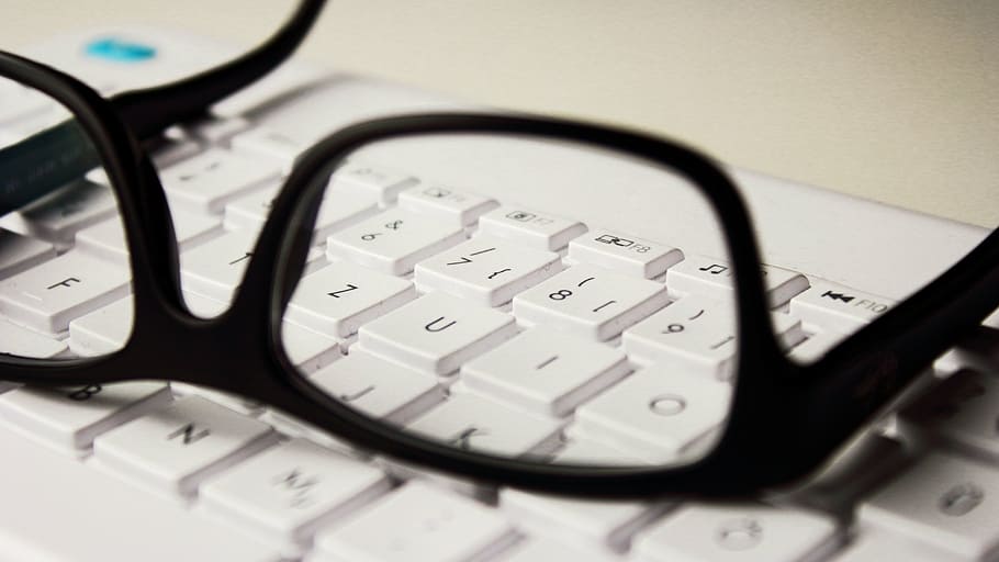 black, framed, eyeglasses, white, comptuer keyboard, glasses, keyboard, workplace, e-book, laptop