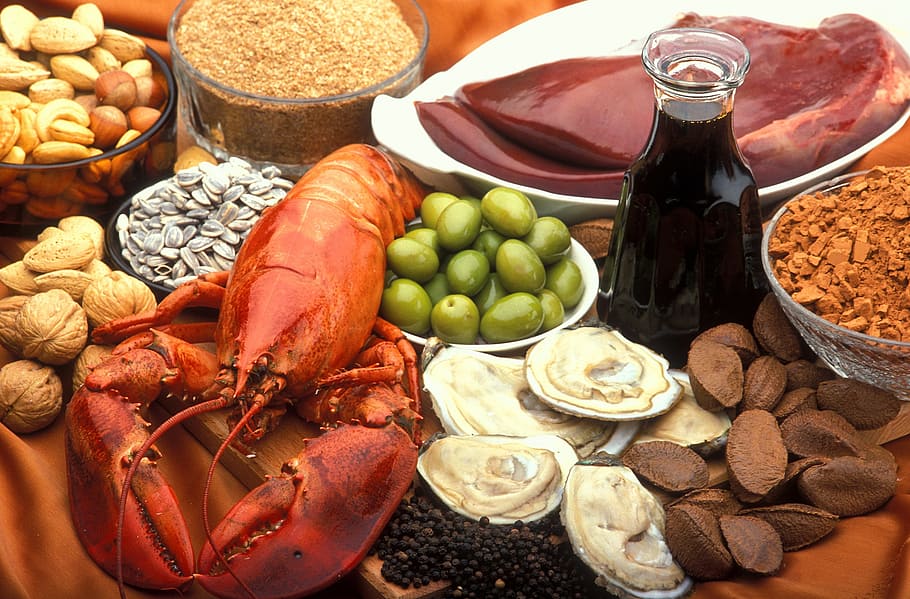 assorted edible foods, power, copper-rich food, oysters, beef, meat, lamb liver, veal liver, carafe, treacle
