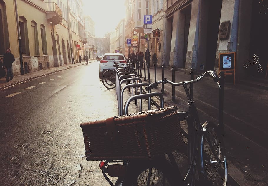 parking, parked, bike, bicycle, basket, car, suv, street, road, buildings