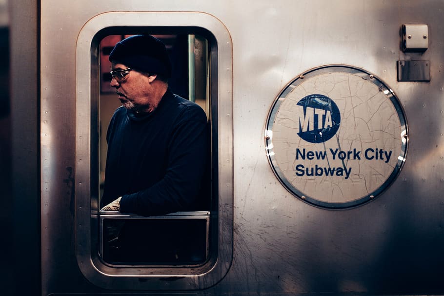 man, leaning, mta, new, york, city, subway, train, door, people