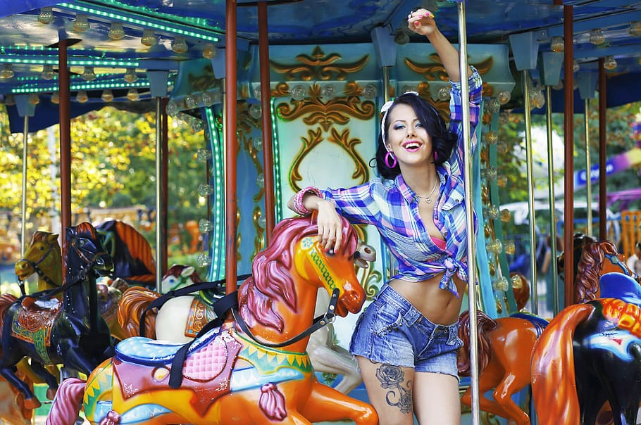 woman, purple, plaid, long-sleeved, button-up shirt, carousel, young, beautiful, person, finger