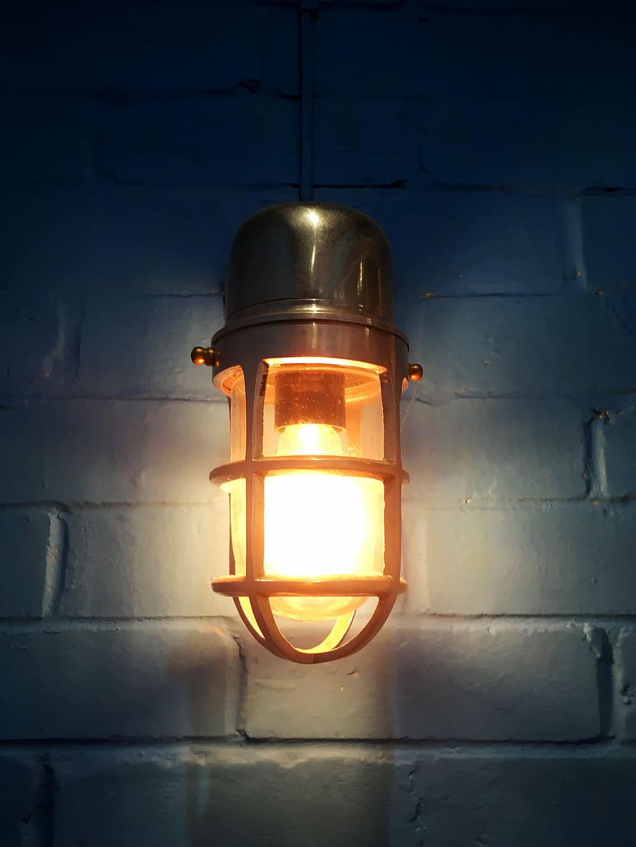 gray, turned-on sconce lamp, cage, white, wall, light bulb, lamp, blue wall, brickwork, electric light