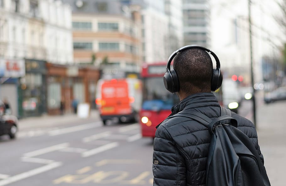 man, standing, street, people, guy, travel, city, black, headphone, backpack
