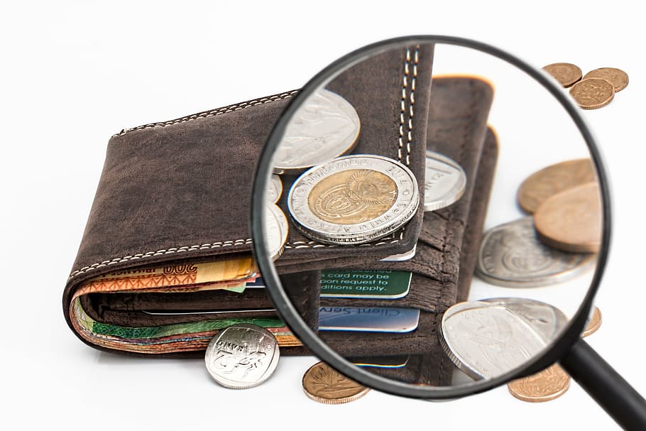 black, magnifying, glass, brown, leather bi-fold wallet, wallet, credit card, cash, investment, money
