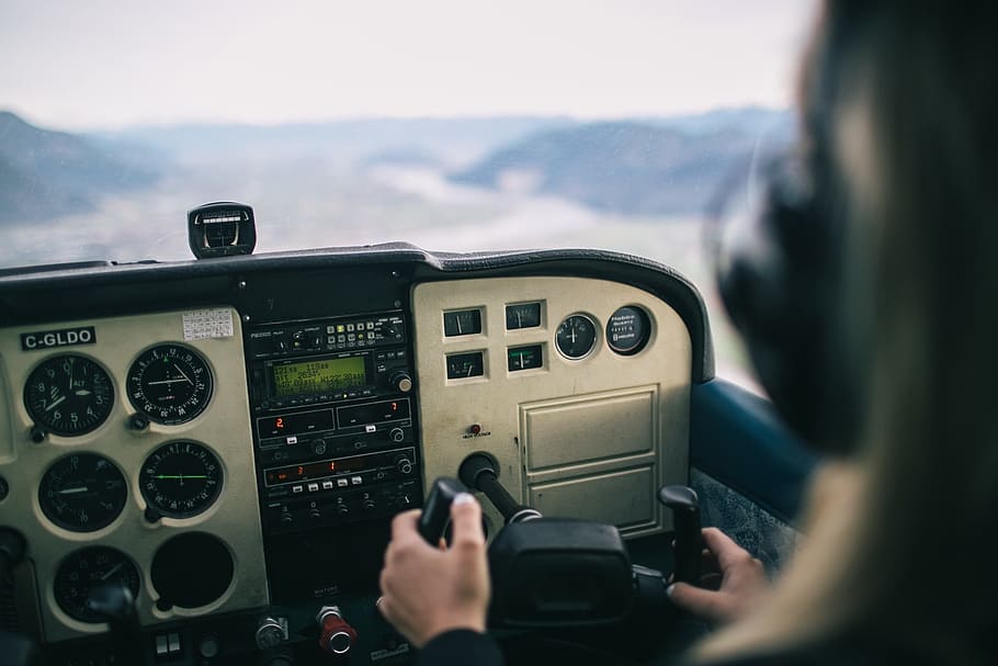 person, driving, plane, daytime, helicopter, cockpit, dashboard, instruments, aviation, technology