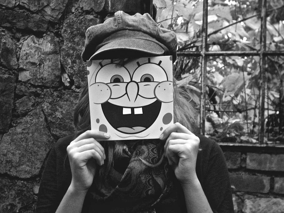 person, holding, spongebob squarepants-printed card, girl, mask, spongebob, black white, people, headshot, one person