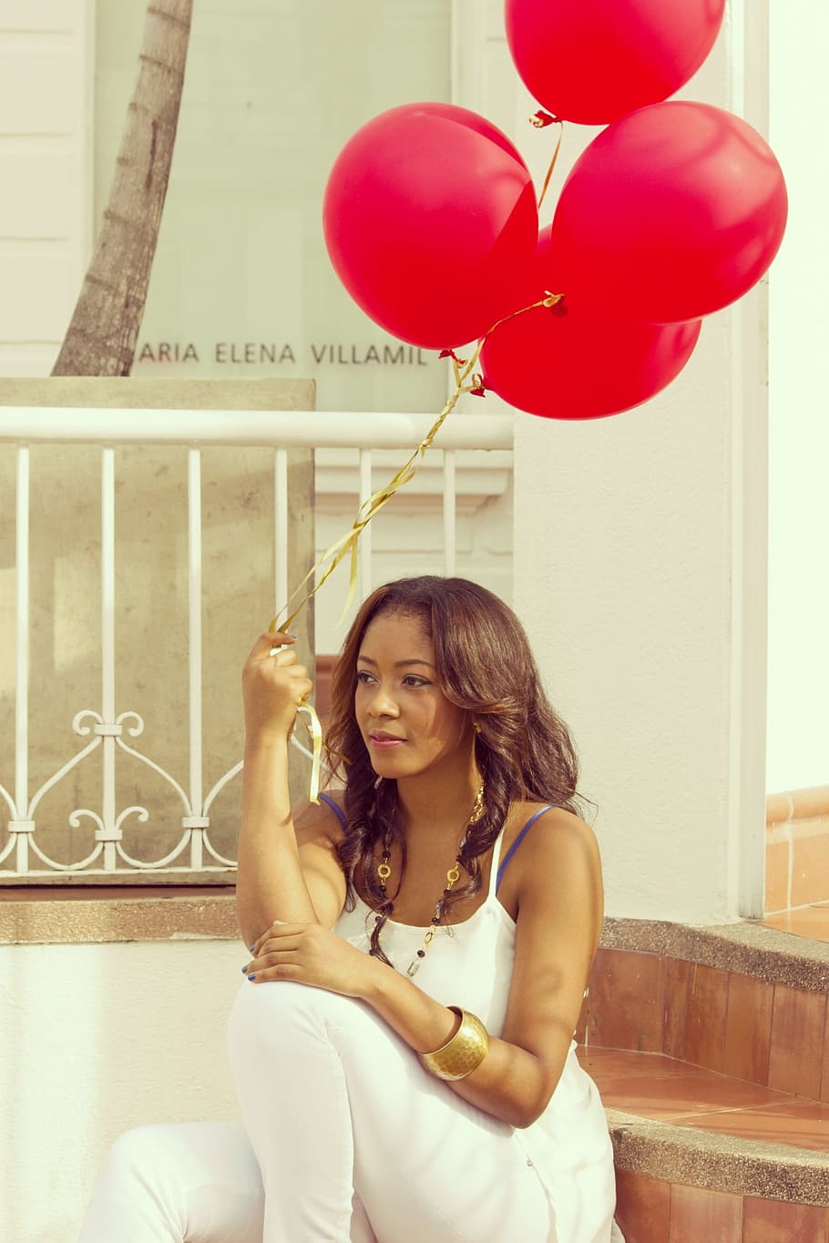 woman, wearing, white, camisole, top, holding, red, balloon, girl, balloons