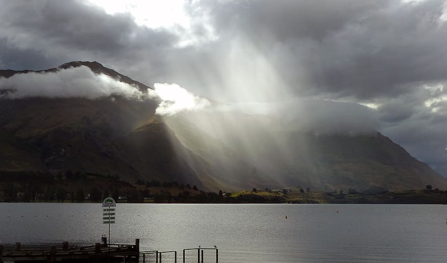 Mount Roy, Lake Wanaka, ocean under cloudy sky, water, cloud - sky, mountain, sky, beauty in nature, scenics - nature, nature