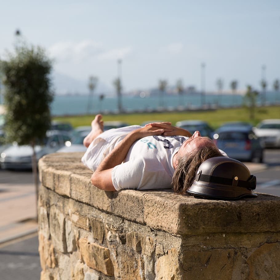 man, lying, brown, concrete, wall, vehicle parking lot, daytime, bilbao, relaxation, sleep