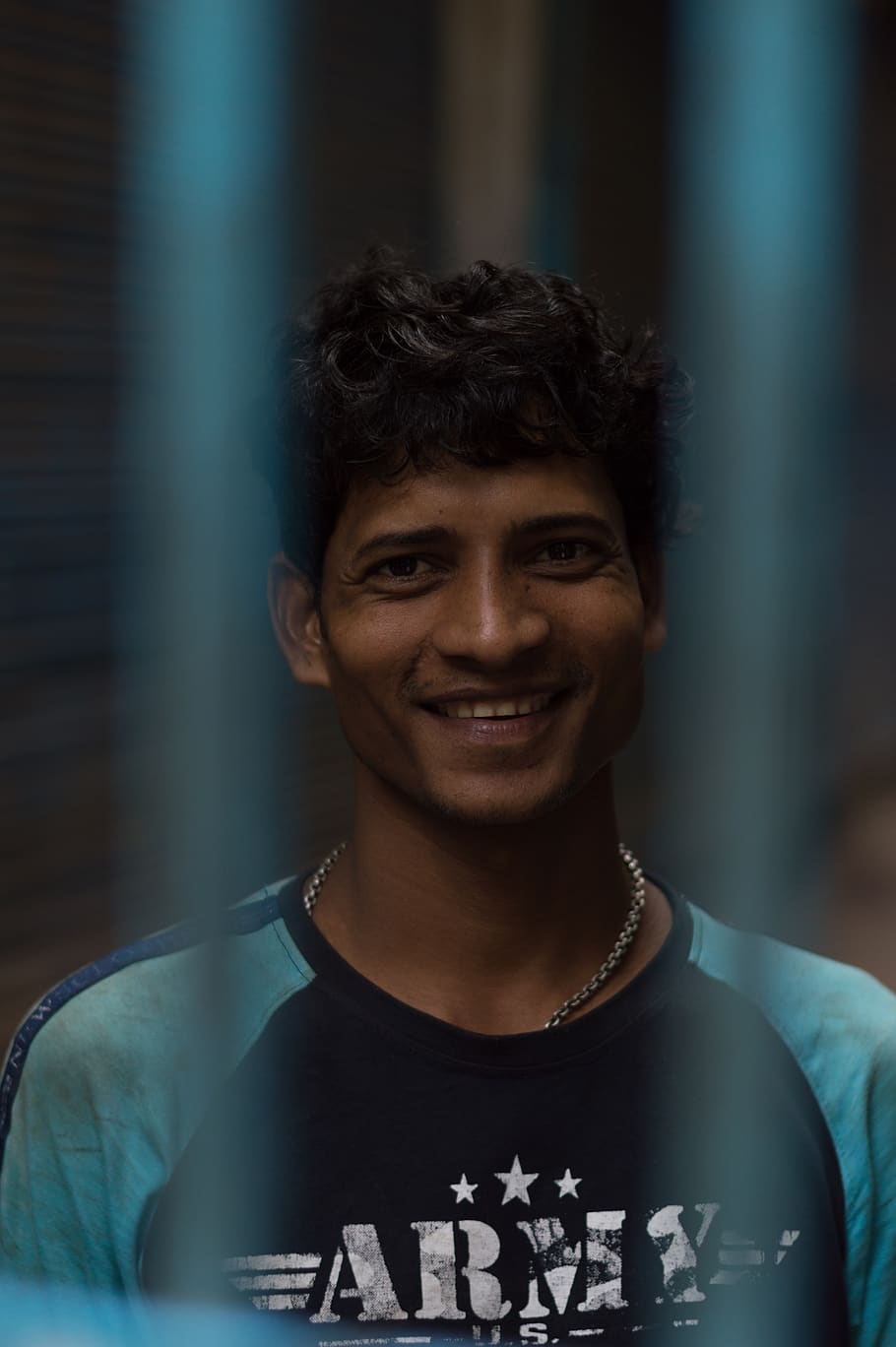 man, happy man, portrait, indian, asian, smile, man behind bars, smiling, one person, front view