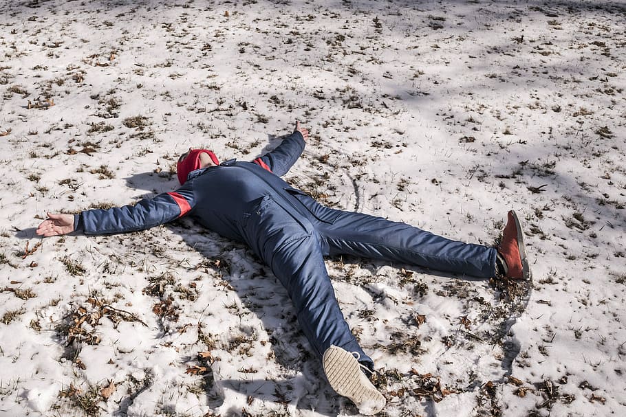 person, blue, overalls, lying, snow, daytime, in blue, people, lazy, angle