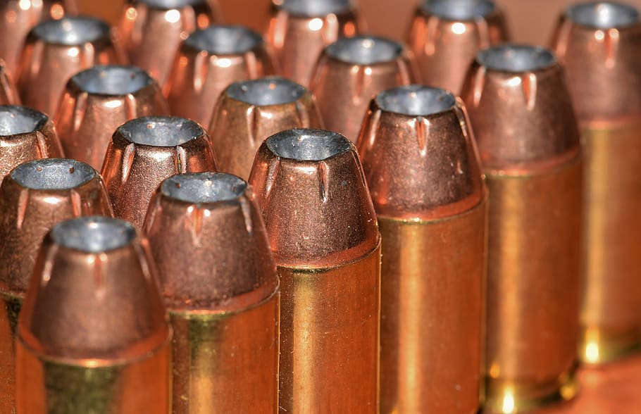 lined, hollow-point ammunition lot, bullets, ammo, ammunition, brass, cartridges, caliber, rounds, acp