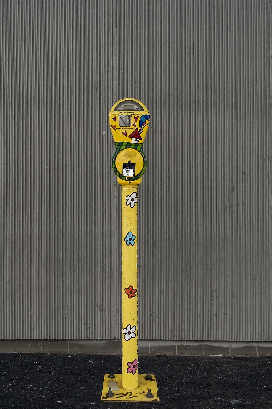 street, parking meter, meter, car, yellow, metal, outdoors, day, corrugated iron, text