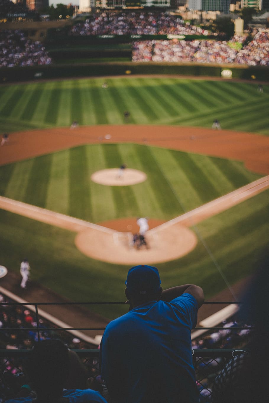 man, watching, outside, baseball field, daytime, selective, focal, sitting, front, baseball