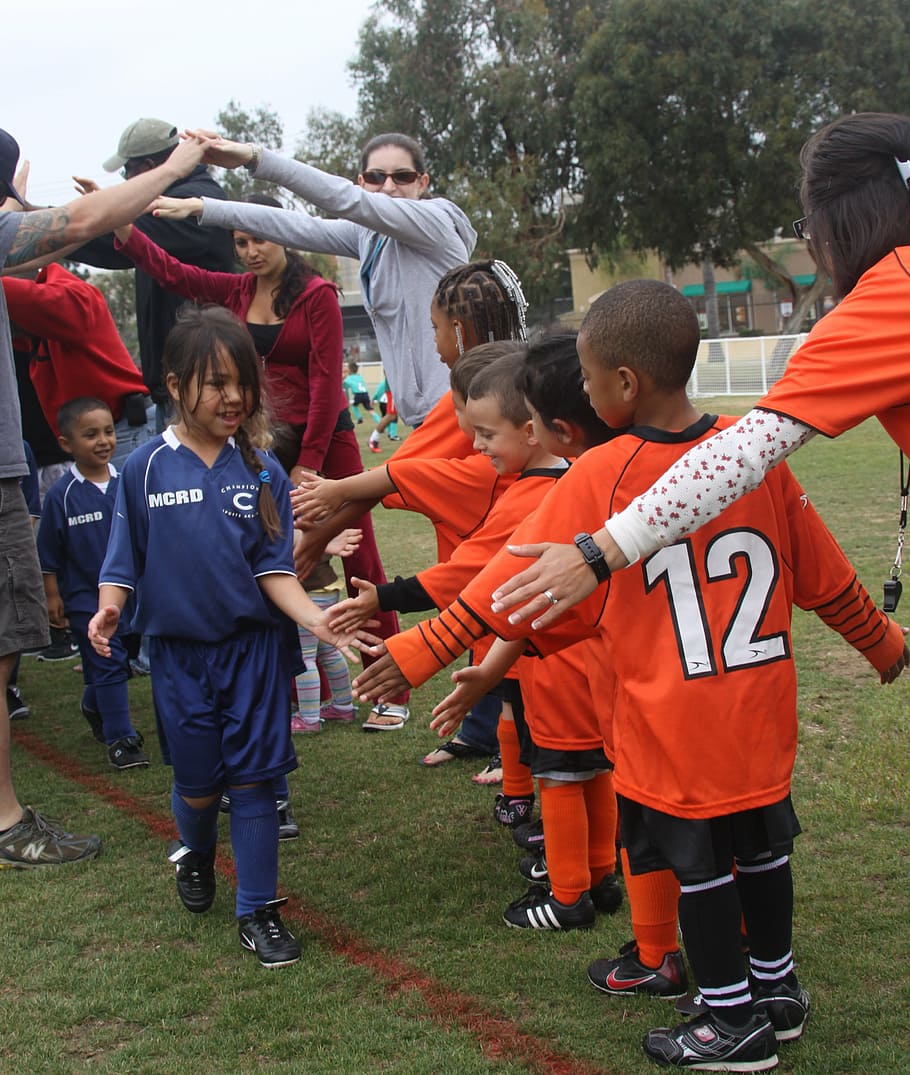 children's playing, children, football match, sportsmanship, smile, handshakes, competing teams, team, competitor, player