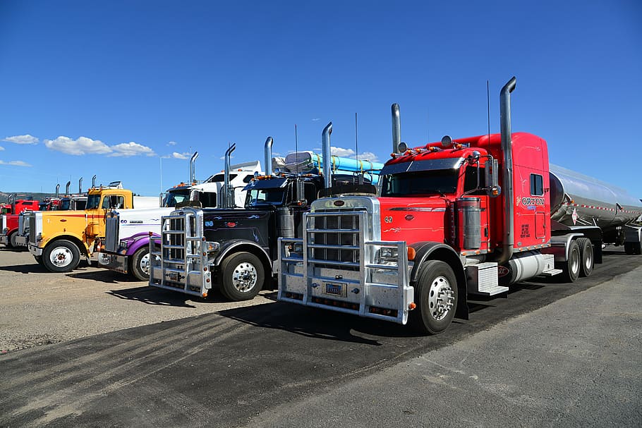 four, assorted-color freight trucks, blue, sky, truck, semi trailers, usa, towing vehicle, red, yellow