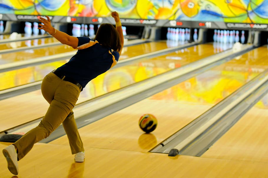woman playing bowling, bowling, bowler, pins, ball, alley, sport, fun, competition, lane
