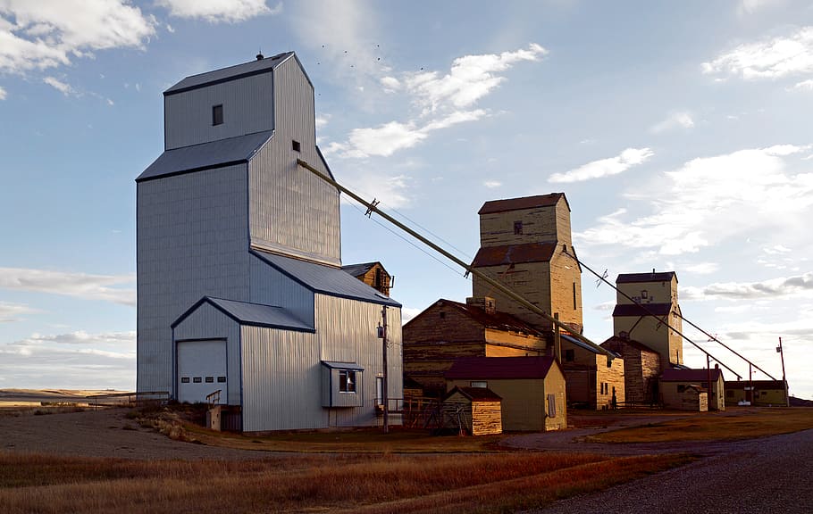 Mossleigh, grain elevators, Alberta, white and brown houses, cloud - sky, sky, architecture, built structure, building exterior, nature
